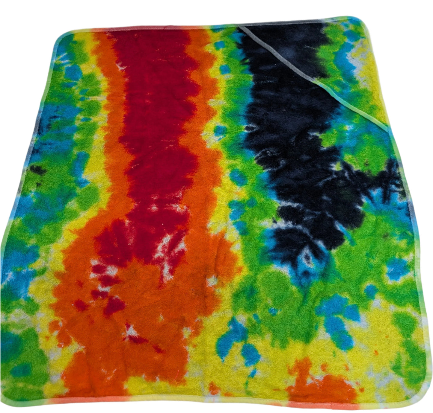 Colorful tie-dye towel on a white surface