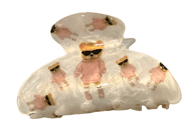 decorative hair clips with teddy bear designs on a white background