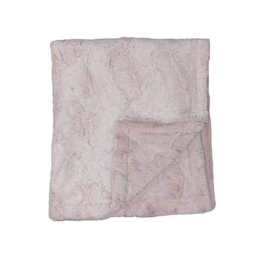 A folded light pink plush blanket with a subtle marble pattern